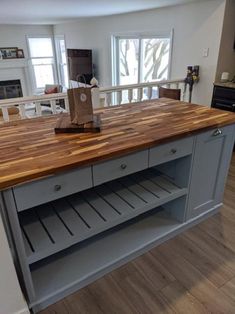 a kitchen island made out of wood and metal