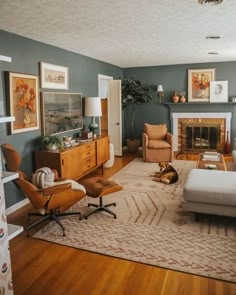 a living room filled with furniture and a dog laying on top of a rug in front of a fire place