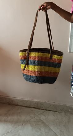 "This listing is for: 1 Sisal & Leather Ladies / Men's Handbag. Original & handmade in Kenya by the Kamba Tribe. Made using natural hand-woven sisal and natural dyes like turmeric, beetroot, Indigo, Soot, & other natural dyes for all of the \"no-run\" colors. You are buying: the bag shown in photos. Includes liner, zipper & leather adjustable handles. Leather is either goat, camel, donkey, or cowhide only. Bone comes from the same domestic animals. --Great for: books, groceries, tablets, smart p Artisan Multicolor Bucket Bag For Daily Use, Artisan Multicolor Bucket Straw Bag, Artisan Multicolor Straw Bucket Bag, Casual Multicolor Bucket Bag With Leather Handles, Multicolor Jute Bucket Beach Bag, Casual Multicolor Straw Bag For Market, Multicolor Basket Crochet Bag Casual Style, Multicolor Basket Crochet Bag, Casual Multicolor Crochet Basket Bag