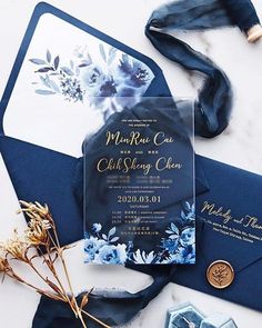 a blue and white wedding suite on top of an envelope