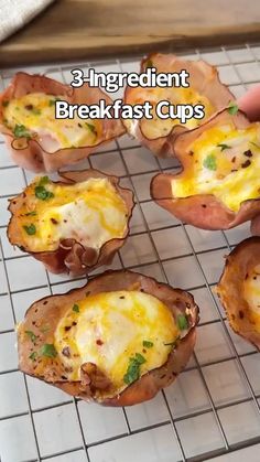 there are eight baked potato cups on the rack with cheese and herbs in them, ready to be eaten