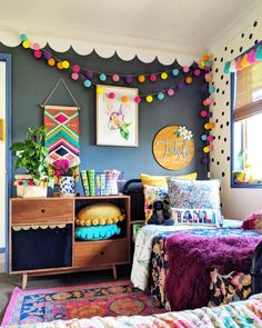 a bedroom with colorful decorations on the walls