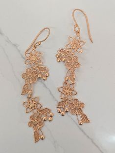 These lovely filigree floral earrings are long and shiny, but as light weight as a whisper. Approximate measurements: 0.5" wide x 3" long 18 kt gold plated over pure brass. Handmade in India in an ethical and fair wage production facility. Ash & Rose exclusive design Anniversary Congratulations, Precious Gemstones Jewelry, Digital Gift Card, Digital Gifts, Curated Gifts, Accessories Diy, Floral Earrings, Ring Bracelet, Semi Precious Gemstones