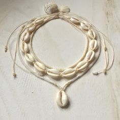 three stranded necklace with shells and pearls