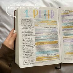 an open bible with the words 1 peter written in different languages on top of it