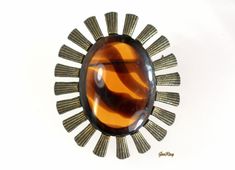 "The gold tone metal with some ornamental poured glass faux tortoise/lucite cabochon. The brooch is 2 3/8\" long, 2\" wide and 0.5\" thick. It weighs 0.9 oz. It is vintage item in EXCELLENT condition. We combine shipping. Thank You for visiting our Etsy store https://www.etsy.com/shop/VictoryIssweet !" Unique Gold Brooches With Cabochon, Unique Gold Brooch With Cabochon, Mid-century Cabochon Brooch Gift, Mid-century Cabochon Brooch For Gift, Mid-century Cabochon Brooches For Gifts, Collectible Gold Cabochon Brooches, Modern Brooch, Deco Retro, Atomic Age