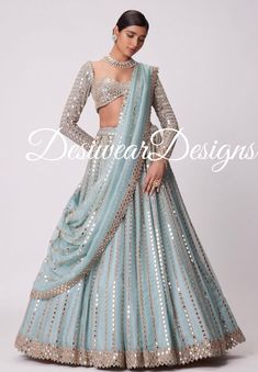 Made to Order/Measurement/Custom Order Lehenga - Color : sku blue - Fabric : Embroidered Net - Fully flared paneled lehenga - Embroidered  Blouse -  Net Dupatta with Gold Border - Drawstring closure with Tassels - - It can be customize in any design or size  PLEASE NOTE: BUYERS ARE RESPONSIBLE FOR ANY CUSTOMS AND IMPORT TAXES THAT MAY APPLY. This is a made to order product. If you opt for 'Made To Measurement Option', we will provide a measurement template and you can share the measurements likewise. If you want to opt for 'Standard Size', Please refer to the size chart provided in the listing. Shipping: Standard Shipping is done by DHL ecommerce and it mostly takes 2 to 3 weeks to deliver after dispatch. Express Shipping is done by DHL express and it mostly delivers within a week after di Mirror Lengha, Bridal Mirror, Blue Lengha, Pink Lengha, Bridesmaids Lehenga, Navy Blue Lehenga, Lehenga Bridesmaid, Lehenga Dress, Wedding Lehenga Choli