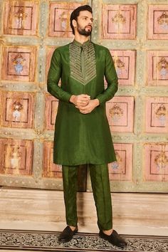 Olive green full sleeves kurta crafted in cotton silk with metallic quad cutdana embroidery on the yoke and mandarin collar neckline. Paired with a pant. - Aza Fashions Green Raw Silk Kurta With Embroidered Border, Green Raw Silk Kurta With Long Sleeves, Green Raw Silk Long Sleeve Kurta, Green Long Sleeve Raw Silk Sherwani, Ceremonial Green Raw Silk Kurta, Green Long Sleeve Kurta With Embroidered Border, Ceremonial Green Long Sleeve Kurta, Green Long Sleeve Traditional Wear With Embroidered Border, Green Embroidered Sherwani For Festivals