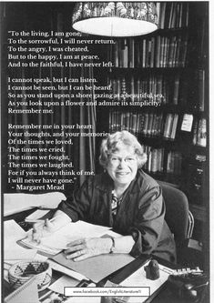 an old woman sitting at a desk in front of a bookshelf