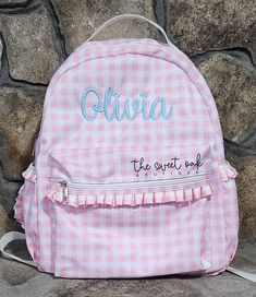 This listing is for a personalized gingham backpack with an embroidered name or monogram. These bags measure APPROXIMATELY 16"x13"x3.5". Due to current stock issues, the size may vary slightly, depending on the vendor used, but we do our best to use the same vendor and be as consistent as possible. Please enter the following in the personalization box below: thread color and name or monogram to add to bag.  All sales are final, so please be sure to double check all spelling. If you have any ques Back To School Gingham Bags, Gingham School Bag For Back To School, Preppy Gingham School Bag, Back To School Gingham Standard Backpack, Preppy Gingham Backpack, Back To School Gingham Bag, Back To School Gingham School Bag, Preppy Personalized Backpack, Kids Bag