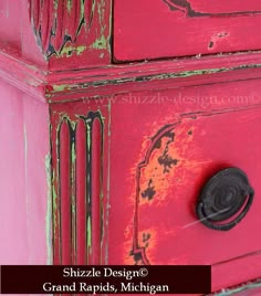 an old red dresser with peeling paint on the top and bottom drawers, painted pink