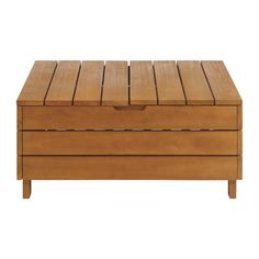 a wooden box sitting on top of a white floor next to a table with drawers