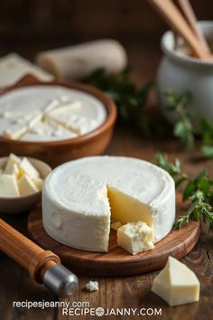 cheese is cut into pieces on a cutting board