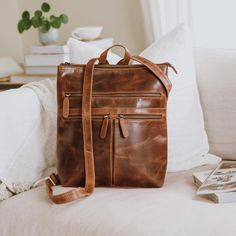 Our Henley leather backpack has been specifically created to carry a 13" laptop.  Designed with a dedicated padded compartment, your device will stay secure and shielded from everyday bumps and scratches.  There are four spacious external pockets, perfect for storing and organising your other belongings. Whether it's your phone, charger, notebooks, or other essentials, you'll find ample space to keep everything in its place.  Whether you're off to Uni, the daily commute,  a city break or as an everyday bag, this backpack will have you covered.  Inside you'll find two main compartments - the back compartment is padded to protect your laptop which is secured by an elasticated velcro strap, leaving the main internal compartment for storing your other belongings.  The three large front zipped Leather Backpack For Everyday Use, Everyday Use Soft Leather Laptop Backpack, Everyday Use Soft Leather Laptop Bag, Leather Laptop Backpack For Everyday Carry, Everyday Leather Backpack With Leather Backing, Leather Backpack Laptop Bag, Everyday Leather Laptop Backpack, Leather Laptop Backpack For On-the-go, Leather-backed Laptop Bag For Everyday Use