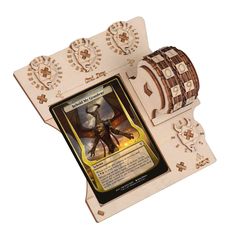 a wooden card holder with an image of a dragon on it's front and back sides