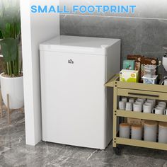 a small white refrigerator sitting next to a shelf