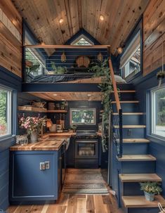 a kitchen and stairs in a tiny home