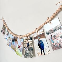 a string of photos hanging on a wall