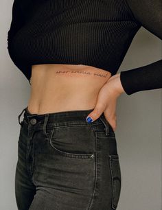 Amor omnia vincit Tat Under Breast, Name Tattoos For Women Under Breast, Below Breast Tattoo, Tats Under Breast, Underboob Quote Tattoo, Sentence Tattoo Placement, Tattoo Breast Woman, Script Rib Tattoo, Under Rib Tattoo