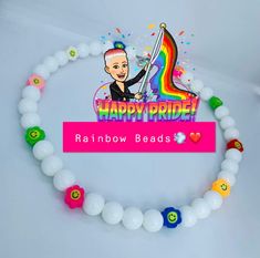 there is a sign that says happy pride rainbow beads