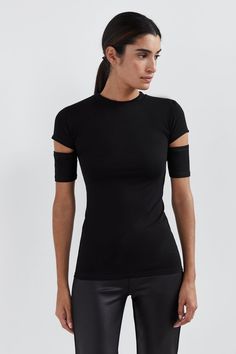 Meet Esme, our essential, oh-so-versatile top with a twist. She features a round neck and dual cutouts at the sleeves that give her the edge you crave. Fashioned from our silky soft, high-stretch and sustainable European Jersey, she's perfect for dressing up or down for that uncomplicated yet hypnotic look.[SPLIT] Sam, in black and in off white, is 5'8" (173 cm) tall, wearing size XS. Stephanie, in black, is 5'9" (175 cm) tall, wearing size L. Lottie, in light beige, is 5'11" (180 cm) tall, wear Edgy Office, Office Top, Jersey Tops, Shes Perfect, Sweatshirt Fabric, The A Team, Jersey Tee, Light Beige, Jeans And Boots