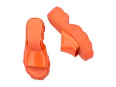 An edgy take on your traditional platform, the Ella Slide brings inspiration from the fisherman-style sandal designed for those who embrace their unique style. With a treaded heel, wide strap, and EVA insole, comfort is top of mind, but being fashionable is always number one. Orange Sandals With Rubber Sole For Spring, Spring Orange Sandals With Rubber Sole, Trendy Flat Platform Clogs, Trendy Closed Toe Sandals With Thick Bottom, Bold Platform Sandals For Spring, Bold Spring Platform Sandals, Summer Sport Sandals With Platform And Open Heel, Platform Sport Sandals With Open Heel For Summer, Summer Chunky Platform Slip-on Sandals