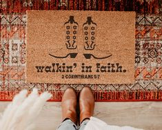 someone standing in front of a door mat with the words walkin'in faith on it