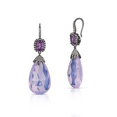 These lovely 18 karat white gold with black rhodium drop earrings feature lavender moon quartz briolettes weighing 53.09 total carats, cushion cut lavender spinel weighing 3.85 total carats, and over 100 round brilliant cut diamonds with a total weight of 0.79 carats. The diamond and lavender quartz drops can be removed from the top of the earrings so the spinel and diamond halos can be worn by themselves. Reference Code: 32657Shop other beautiful pieces in our Earring Collection.For inquiries o Elegant Lavender Evening Jewelry, Elegant Lavender Jewelry For Evening, Elegant Lavender Earrings With Gemstone Accents, Lavender Moon, Moon Quartz, Lavender Quartz, Earring Collection, Black Rhodium, Round Brilliant Cut Diamond