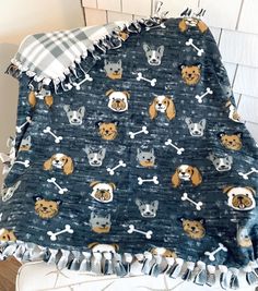 a blanket with dogs and bones on it