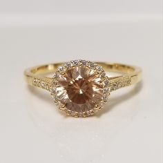 "Thanks for shopping our vintage estate store. We tend to sell well below wholesale and truly hope you enjoy all of our items. Many of the items are one of a kind, so please enjoy scrolling through the pictures and hopefully something will catch your eye. Brown spots from the camera or reflections. Estate 18k gold over sterling silver 925 copper honey 2ct champagne white CZ diamond princess ring.  Ring size: please select size Setting:  10mm 3/8\" CZ Diamond: 8mm center Band width: 2mm Weight: 3.38 grams Beautiful ring. No scratches on the stone. Marked 925." Gold Topaz Ring With Halo Setting In 14k Gold, Gold Topaz Ring With Accent Stones For Anniversary, Gold Topaz Ring With Halo Setting, Classic Rose Gold Topaz Ring, Classic Formal Topaz Ring With Halo Design, Formal Classic Topaz Ring With Halo Design, Gold Topaz Diamond Ring With Center Stone, Classic Gold Topaz Ring With Accent Stones, Gold Topaz Ring With Cubic Zirconia Accent Stones