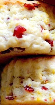 several pieces of bread with cranberries on them sitting in a pile next to each other