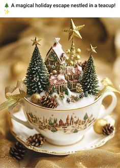 a teacup filled with christmas trees and decorations