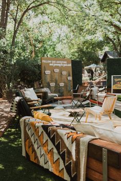 several chairs and tables are set up in the grass