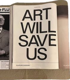 a newspaper with an article about art will save us