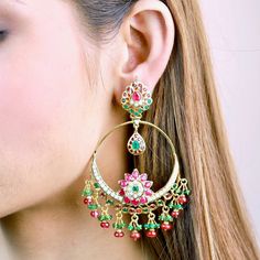 Chandbali earrings in sterling silver with 22K gold plating. It has been set with freshwater pearls and synthetic rubies and emeralds. The hanging beads are real rubies and emeralds of very good color and clarity. Weight 31 GMs Dimensions : 2.5 x 1.75 inches Traditional Jeweled Gold-plated Earrings, Traditional Emerald Earrings For Festive Season, Traditional Emerald Drop Earrings, Traditional Festive Emerald Earrings, Festive Gold Emerald Earrings, Festive Emerald Earrings, Green 22k Gold Chandbali Earrings, 22k Gold Green Chandbali Earrings, Traditional Green Dangle Pearl Earrings