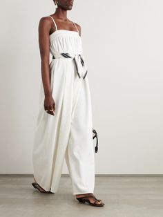 The playfully relaxed proportions of The Frankie Shop's 'Maude' jumpsuit radiate ease and joy. It's made from denim that's gathered through the neckline and falls to wide legs. It's the kind of piece that'll look equally chic with plenty of wear over the years. Swimsuit Jewelry, The Frankie Shop, Frankie Shop, Sport Swimwear, Sports Skirts, White Jumpsuit, Knitwear Tops, Wide Legs, Denim Jumpsuit