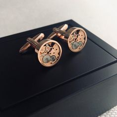 Elevate your formalwear with these unique cufflinks featuring real Omega movements, embodying a distinctive steampunk aesthetic. Crafted as a one-of-a-kind steampunk gift for men, these vintage real watch cuff links blend retro metal mechanical charm with modern sophistication. Each pair showcases non-working watches, meticulously upcycled into stylish accessories that reflect craftsmanship and creativity. Ideal for those who appreciate the art of upcycling and the elegance of vintage mechanical Luxury Antique Cufflinks For Anniversary, Luxury Vintage Cufflinks For Collectors, Round Screw Back Cufflinks For Business, Steampunk Gold Watch As Gift, Gold Steampunk Watch For Gift, Gold Steampunk Style Watch As Gift, Gold Steampunk Watch As Gift, Antique Round Cufflinks For Formal Occasions, Round Cufflinks With Screw Back For Gift