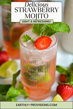 a strawberry mojit with mint and lime garnish on the rim, next to strawberries