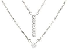 Bella Luce® white diamond simulant 1.05ctw round, rhodium over sterling silver necklace set. Necklace drops measure approximately 0.81" L x 0.13" W and 0.25" L x 0.025" W. Both include a 18.00" L x 0.03" W and and have a 2" extender lobster claw clasp closure. The diamond equivalent weight is 0.63ctw. Fine Jewelry Diamond White Channel Set Necklace, Diamond White Channel Set Necklace, Silver Channel Set Fine Jewelry Necklace, Fine Jewelry White Necklace Channel Set, White Channel Set Fine Jewelry Necklace, Anniversary Diamond White Channel Set Necklaces, Diamond White Channel Set Necklace For Anniversary, Diamond White Channel Set Necklaces For Anniversary, Diamond White Necklaces With Channel Set For Anniversary