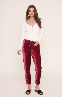 The Jagger Joggers are made comfortable with the soft elastic waist and drawstring closure. These sweatpants are perfect for being comfy and lounging around, but can also be a statement piece to wear around town. Super soft, super cute, and you'll never want to take them off. Red Velvet Pants, Travel Shoes Women, Travel Pants Women, Velvet Sweatpants, Sangria Red, Travel Skirt, Velvet Joggers, Red Sangria, Green Joggers