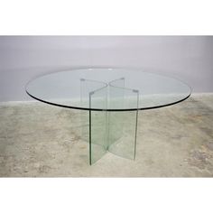 a round glass table with three sections on each side and one section at the end