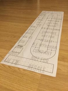 the floor plan for an indoor hockey rink is laid out on top of a hard wood floor