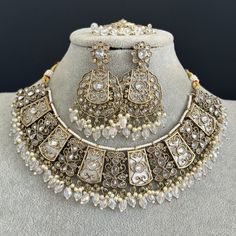 White Antique Polki Kundan necklace set/Reverse Ad Necklace/Statement necklace/Indian/Punjabi Necklace/Pakistani Jewelry/Bridal necklace/ Antique Reverse Ad Stone Necklace With Mehndi Plating Regular Size And Adjustable Stone Necklace Antique Necklace Set with dull gold finish  This is 100% Handmade jewelry. So Color, shades, texture displayed may slightly vary from the actual product due to digital image limitations. We request you to consider these minor variations. Please expect the possibili Luxury White Bollywood Temple Necklace, Silver Tilla Jewelry Sets For Eid, Traditional White Metal Necklace, Metal Chandbali Kundan Necklace For Diwali, Bollywood Style Metal Kundan Necklace For Diwali, Silver Jewelry Sets With Stone Work For Eid, Diwali Metal Chandbali Kundan Necklace, Eid Silver Jewelry Sets With Stone Work, Diwali Chandbali Kundan Metal Necklace