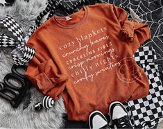 Fall Sweatshirt - Cozy Season Sweatshirt - Cute Fall Sweater - Fall Tees - Crewneck Sweater - Fall Sweatshirt - Graphic Sweater AT CHECKOUT: ▪️ Sweatshirt Color(shown in Texas Orange) ▪️ Size ▪️ Design Color SWEATSHIRT INFO: ▪️ All sweatshirts are unisex fit. Please refer to the size chart provided in the listing photos for more details. ▪️ Unisex, Jerzee Cotton/Poly Blend ▪️ Size up 1-2 sizes for an oversized look DESIGN INFO: ▪️ Design is heat transfer vinyl and is applied to each shirt with a Winter Sweater With Text Print For Loungewear, Winter Text Print Sweater For Loungewear, Winter Loungewear Sweater With Text Print, Comfy Cotton Tops With Graphic Print, Comfy Soft-washed Winter Tops, Trendy Winter Loungewear T-shirt, Cozy Text Print Sweatshirt For Fall, Cozy Letter Print T-shirt For Loungewear, Comfy Letter Print Tops For Loungewear