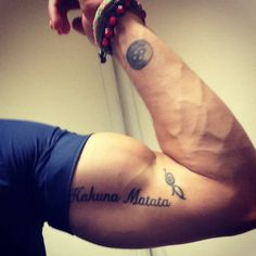 a man's arm with the words mauna mata written on it and his name tattoo