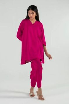 Introducing our stunning and chic two-piece kurta and pants set - a must-have addition to your wardrobe. Made from high-quality fabric, this set is designed for both comfort and style. The kurta features delicate details that add a touch of elegance to your look. The length of the kurta is just right, hitting just above the knees for a modern and sophisticated look.  The pants are designed in a straight leg style, featuring a comfortable and adjustable waistband for a perfect fit. The length is just right to complement the kurta, creating a cohesive and stylish outfit. Whether you're attending a wedding, Eid celebration, or simply want to elevate your everyday look, this set is perfect for any occasion. Pair it with your favorite accessories, shoes, and bag to create a complete look that w Traditional Festive Pant Set With Set-in Sleeves, Festive Straight Kurta With Set-in Sleeves, Festive Pink Set With Set-in Sleeves, Festive Palazzo Set With Set-in Sleeves For Eid, Traditional Designer Sets With Set-in Sleeves, Traditional Sets With Set-in Sleeves For Eid, Designer Wear Sets With Set-in Sleeves For Eid, Eid Pant Set With Long Set-in Sleeves, Eid Straight Kurta With Set-in Sleeves