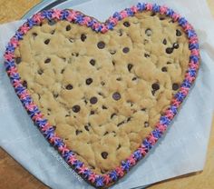 a heart shaped cookie sitting on top of a piece of paper