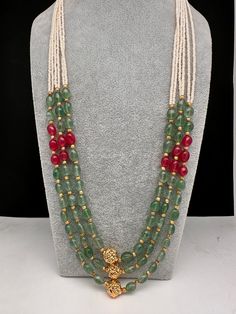 Emerald Ruby Pearls Nakshi Multi Layer Necklace Only Neckalce no earringsColor : GoldenSize : Necklace Length : 22 Inches Approx;Stones : Pearl Real Emeralds Nakshi Balls