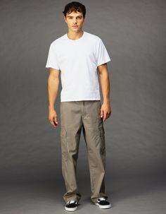 Rsq Loose Cargo Pants. Button Waist Paired With Zipper Fly. Cargo Pockets On Both Legs. Side Slip Pockets. Back Pockets With Button Closure. Approx. Leg Opening: 20". Machine Wash. 100% Cotton. Imported. Mens Cargo Pant Outfit, Mens Outfits Cargo Pants, Men’s Cargos, Casual Cotton Cargo Jeans With Button Closure, Casual Streetwear Pants With Button Closure, Casual Cargo Pants With Button Closure, Casual Cotton Cargo Pants With Button Closure, Casual Pants With Button Closure For Streetwear, Straight Leg Cotton Cargo Pants With Button Closure