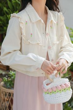 Sweet and delicate cropped jacket for your cottagecore adventures. Features pink heart buttons, frills and little embroidered flowers. S: 15" across shoulders, 40" chest, 17" lengthM: 15.5" across shoulders, 41.5" chest, 17" lengthL: 16" across shoulders, 43" chest, 17.5" length Cute Beige Outerwear For Spring, Cute Spring Outerwear With Buttons, White Large Capacity Flower-shaped Shoulder Bag, White Flower-shaped Large Capacity Shoulder Bag, White Floral Embroidered Top With Doll Collar, White Cropped Jacket With Button Closure, Pink Cotton Kawaii Outerwear, Heart Button, Shoe Gifts